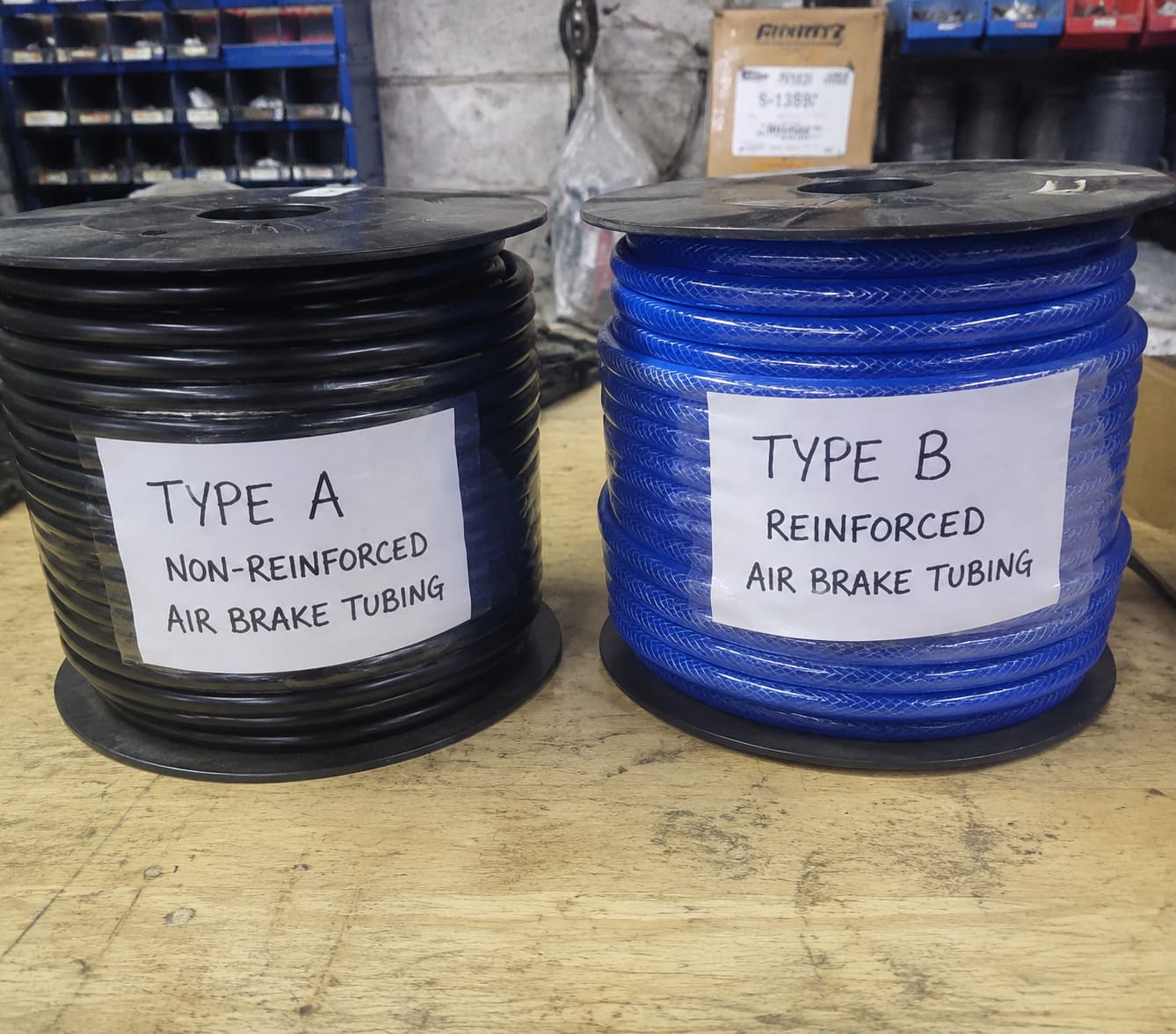 Type A vs Type B air brake tubing difference a side-by-side comparison of black and blue air brake tubing spools with type a and type b markings