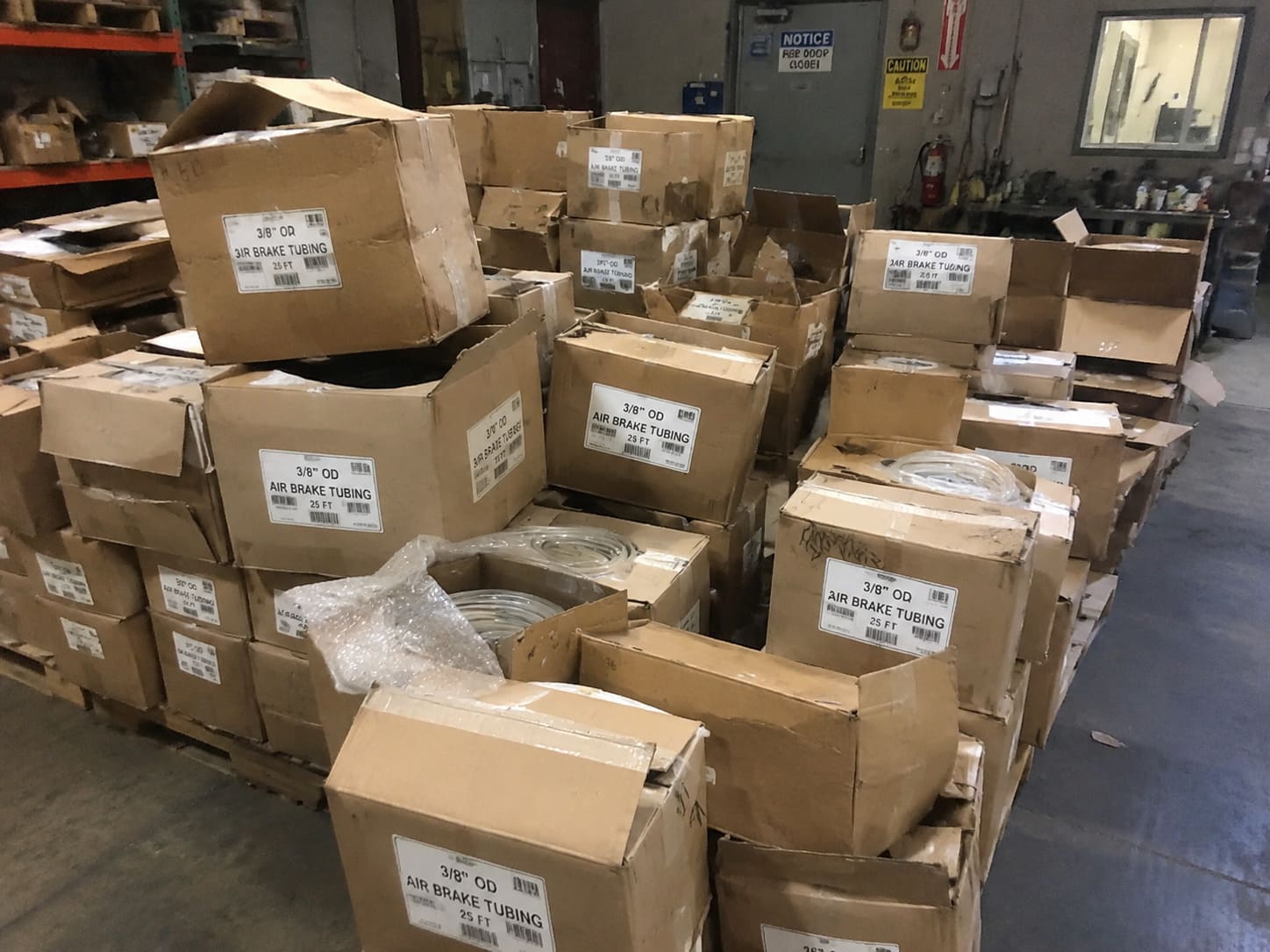 Procurement risk wrong air brake tubing type stack of returned air brake tubing boxes in a warehouse showing inventory mismatch risk